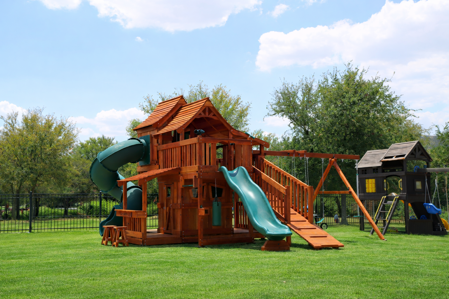 Premium redwood playset showcasing natural weather resistance, durability, and timeless beauty for outdoor family adventures. Maverick-Tri-Level-Swing-Set-Slide